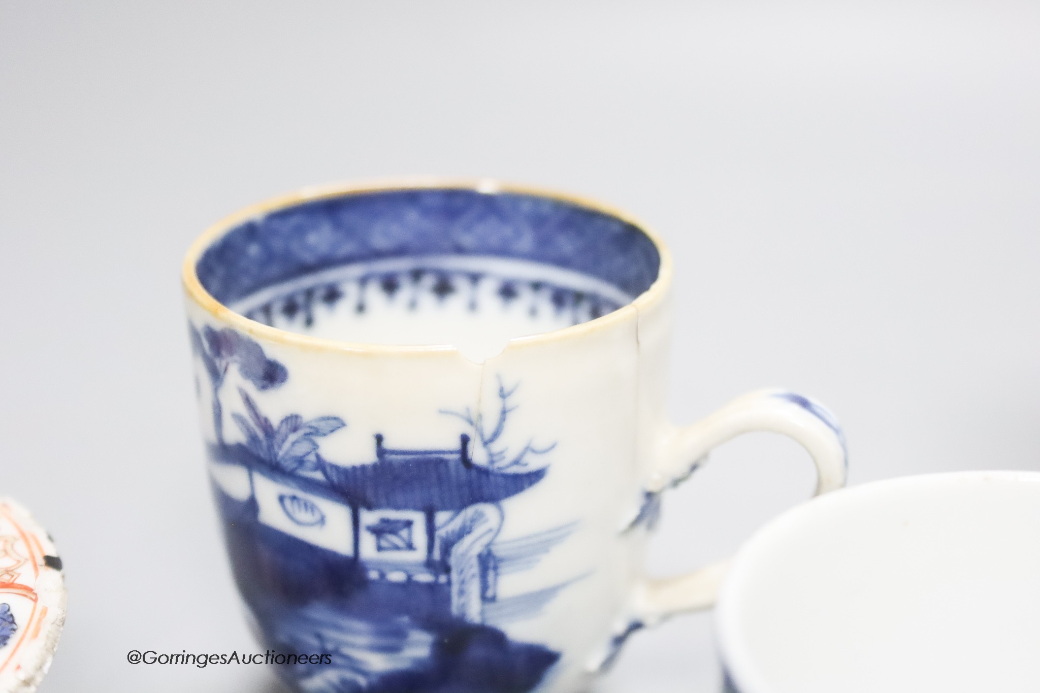 Three Chinese export coffee cups and a similar salt cellar, 18th century